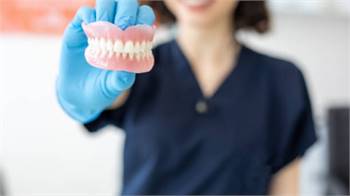 How to reduce discomfort after placing dentures?